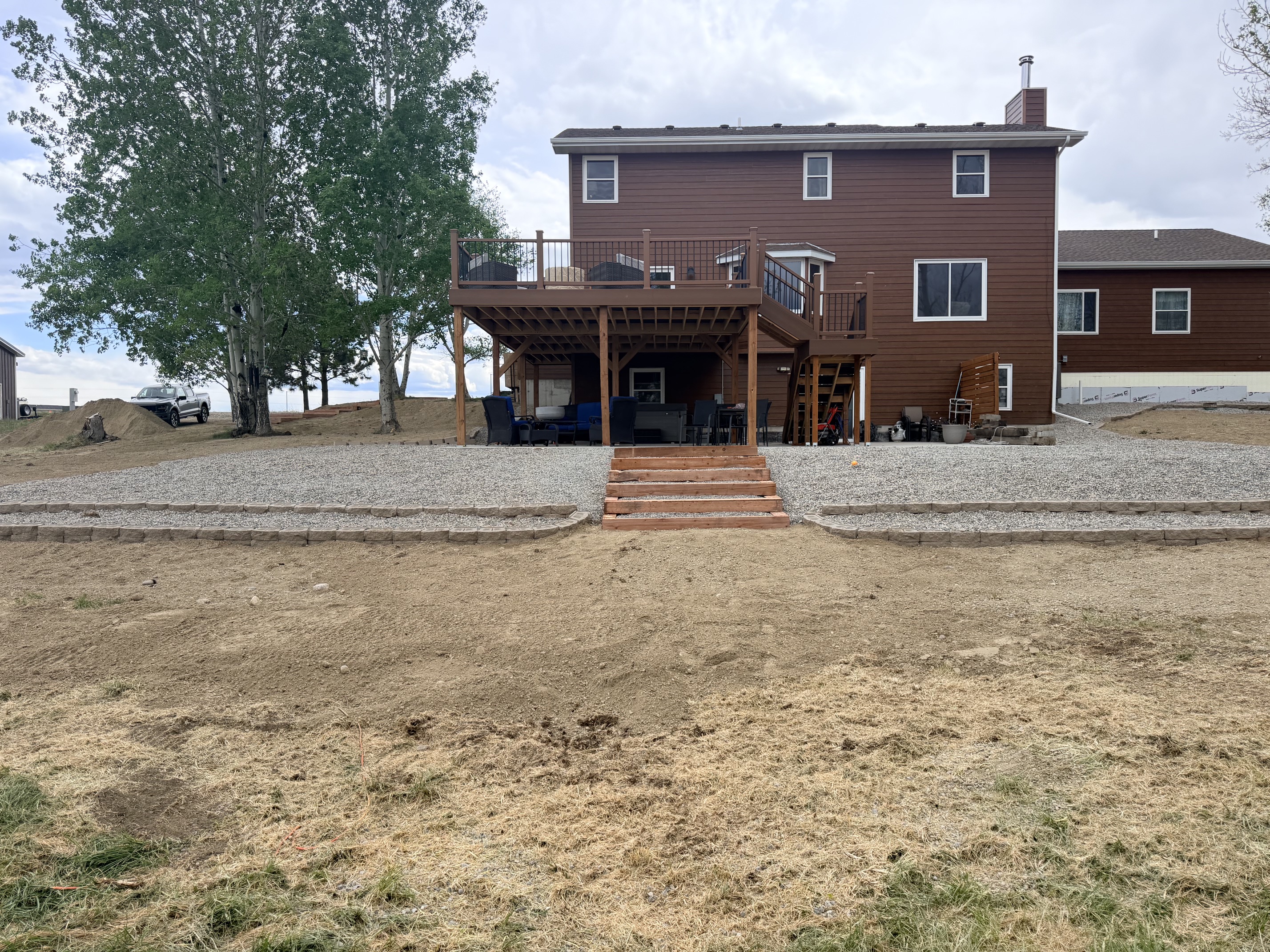 After - graded yard with retaining wall